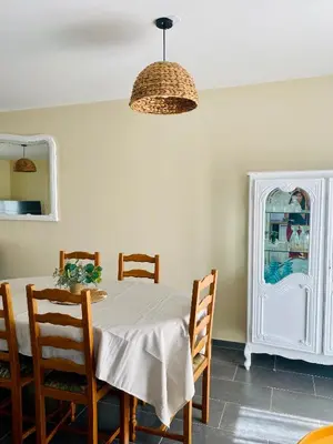 a dining room with a table and chairs at Maison avec piscine et jardin in Salses-le-Chateau