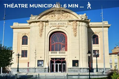 a large white building with a large window at Le Baroque - Grand T2 Confort, Lit Queen Size in Castres