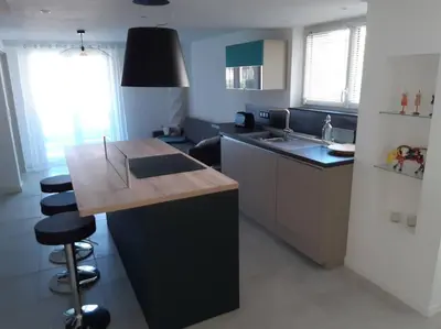 a kitchen with a wooden counter top in a room at Gite Beau Soleil in Roquecourbe