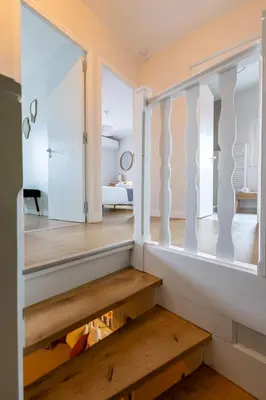 a room with a staircase leading to a bedroom at Le Savane - Grand Triplex Confort & Chaleureux, 2 Salons in Castres