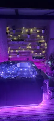 a patio with lit candles and a table with a table at LeMasBlanc, Chambre d'hôtes & jacuzzi privé, au calme, 15min de Carcassonne in Malves-en-Minervois