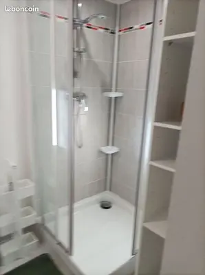 a shower with a glass door in a bathroom at Chez Sabine La Campagne in Narbonne
