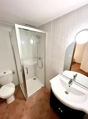 a bathroom with a shower and a toilet and a sink at Les chambres de la bastide - 204 in Carcassonne