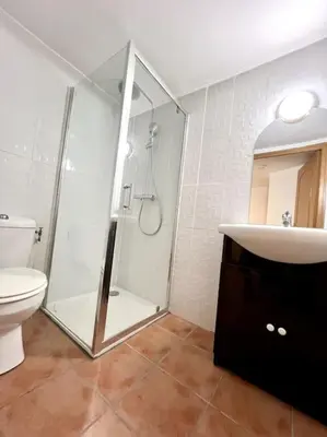 a bathroom with a shower and a toilet and a sink at Les chambres de la bastide - 204 in Carcassonne