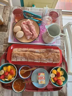 two trays of food on a table with food at Camping Nysa Paziols in Paziols