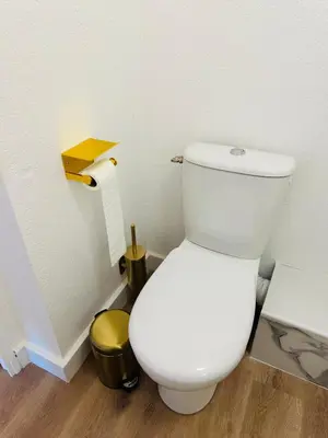 a bathroom with a toilet and a roll of toilet paper at You&Me hyper centre ville avec draps serviettes ménage final in Narbonne
