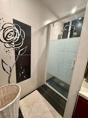 a bathroom with a shower with a glass door at La Maison de Sainte-Eulalie in Roubia