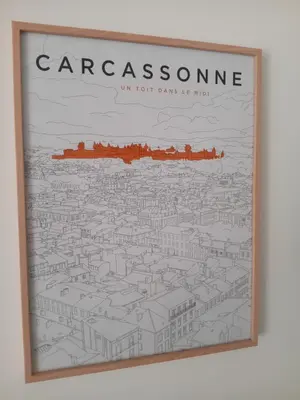 a framed drawing of a city with the wordsarcassosphere at Le Grenadier in Ventenac-Cabardès