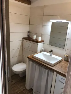 a bathroom with a sink and a toilet at Le Grenadier in Ventenac-Cabardès