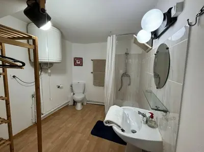 a bathroom with a sink and a toilet at Central apartment in Quillan in Quillan