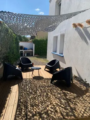 a group of chairs and a table on a patio at Ancienne maison de pêcheurs in Port-la-Nouvelle