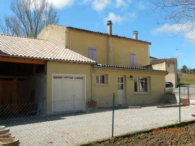 a house with a fence in front of it at GITE Le calme de la campagne plus le confort in Viviès