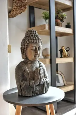 a statue sitting on a table in a room at Loft de caractère centre-ville in Narbonne