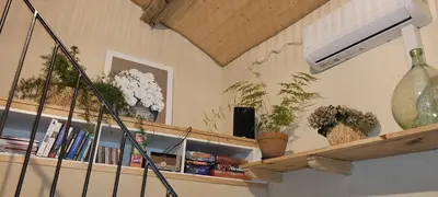 a room with a shelf with potted plants on it at le gîte du Cantou in Lautrec