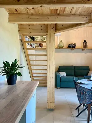 a living room with a couch and a table at le gîte du Cantou in Lautrec