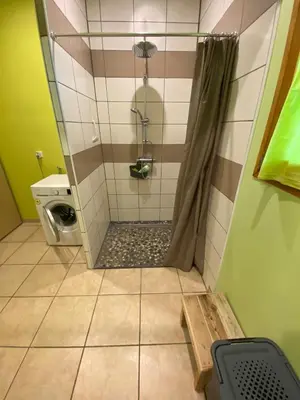 a bathroom with a shower and a toilet in it at Appartement T2 spacieux in Trévillach