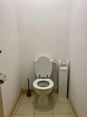 a bathroom with a toilet with the lid up at T3 situé près de la Place Carnot in Carcassone