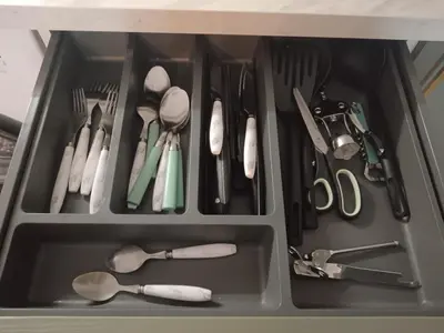 a drawer filled with utensils and utensils at Le Cosy Bernard , Parking, Piscine, Netflix in Carcassonne
