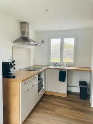 a kitchen with a sink and a counter top at Charmante Maison l Jardin l Clim in Carbes