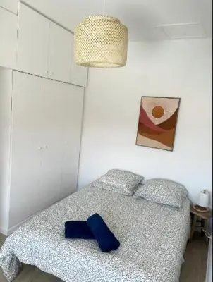 a blue bow tie sitting on top of a bed at Le Borel I in Castres