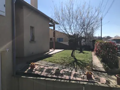 a view from a window of a house with a yard at Chez Sophie et Bernard in Saverdun