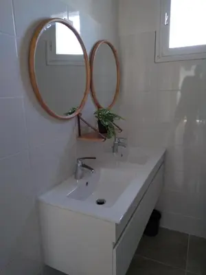 a bathroom with a sink and a mirror on the wall at villa au calme 6 couchages in Trèbes