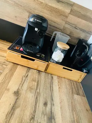a coffee maker sitting on top of a table at Maison T3 avec jardin in Narbonne