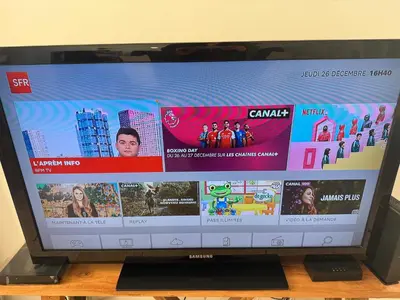 a television screen with a bunch of pictures on it at Maison T3 avec jardin in Narbonne