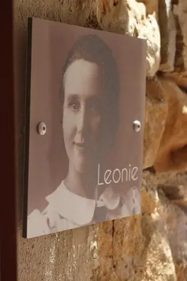 a picture of a woman on a wall at Louis Henry in Saint-Pierre-des-Champs