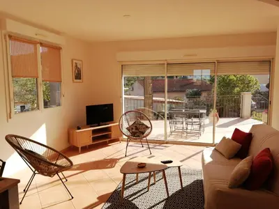a living room with a couch and chairs at GITE CHEZ JULES ET ODETTE in Comigne