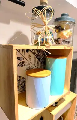 a wooden shelf with two buckets on it at agréable studio in Narbonne