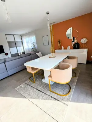 a living room with a white table and chairs at Villa 