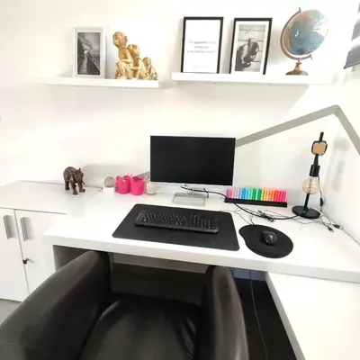 a desk with a computer monitor and a keyboard at Villa 