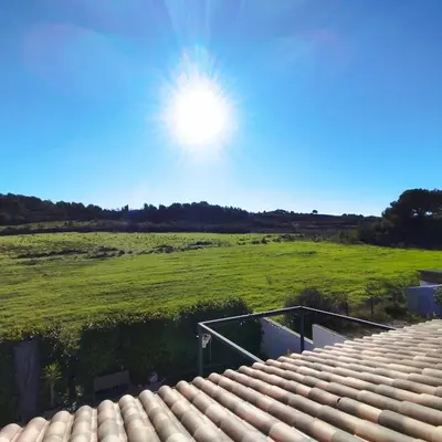 a view of a field from the roof of a house at Villa 