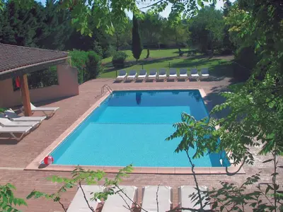 a swimming pool with lounge chairs next to it at Château de la Motte - Entre Narbonne et le Canal du Midi in Marcorignan