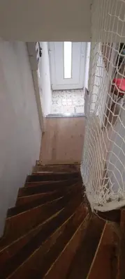 a stairway with a door and a window at Le Careyrou in Paziols