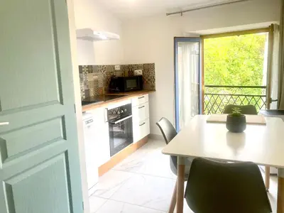 a kitchen with a table and a table and a window at 