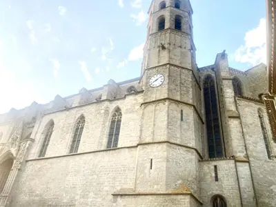 a clock tower on the side of a church at 