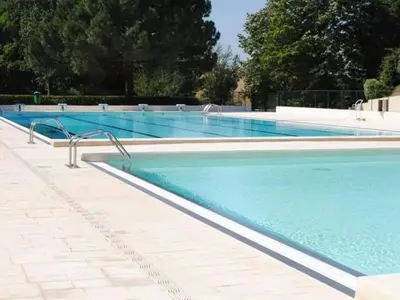 a large swimming pool with blue water at 