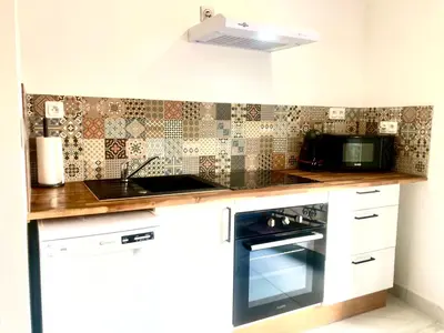 a kitchen with a stove and a microwave at 