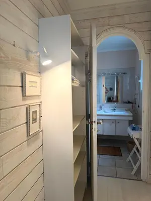 an open door to a kitchen with a sink at la vue des étangs in Bages