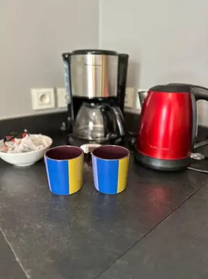 three cups on a kitchen counter with a coffee pot at Gorgeous 5 bedroom villa with air con, heated pool and garden for 12 in Villemoustaussou
