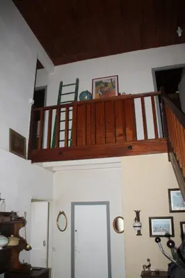 a staircase in a room with a stair case at Chez Didier 1 in Saint-Michel-de-Lanès