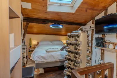 a small bedroom with a bed and a window at The retreat in Montréal