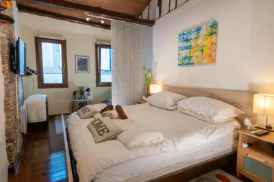 a bedroom with a large bed with white sheets and pillows at The retreat in Montréal