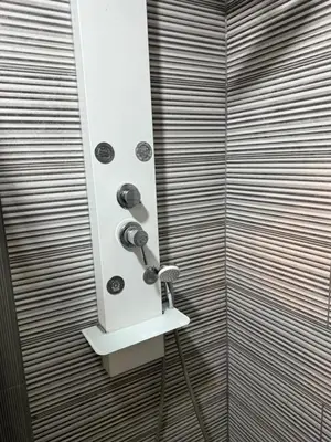 a bathroom with a shower with a shower head at Maison de vacances in Conilhac-Corbières
