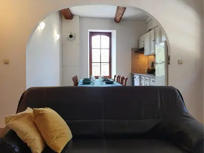a living room with a couch and a table at La Roche 6 in Aigues-Vives