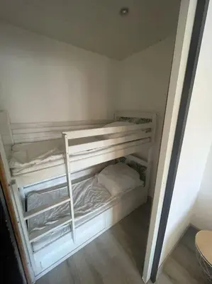 a white room with two bunk beds in it at Palma Studio bis 4 pers - 100m plage in Port-la-Nouvelle
