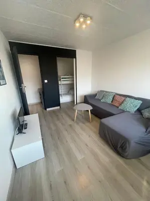 a living room with a couch and a table at Palma Studio bis 4 pers - 100m plage in Port-la-Nouvelle