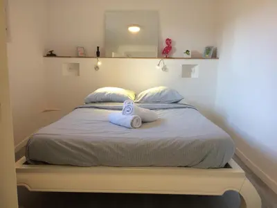 a bed with two towels sitting on top of it at Anna's gîte in Lagrasse